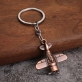 Vintage red copper airplane keychain with detailed miniature engine design and sturdy ring - Propeller Airplane (Style B) / Antique Red