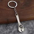 Detailed view of creative metal wrench keychain with polished finish and industrial style - Adjustable Wrench