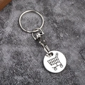 Close-up of silver metal shopping trolley coin keychain with a lobster clasp - Oxidized White Gold Tone