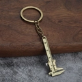 Porte-clés mini pied à coulisse en bronze avec règle mobile et échelle de mesure - Pied à Coulisse en Bronze