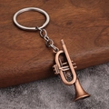 Porte-clés trompette en bronze vintage avec finition métal rustique et anneau - Style C (Trompette) - Rouge Antique