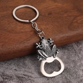 Macro detail of retro silver frog zinc alloy bottle opener keychain with relief texture - Frog Design - Antique Tin