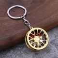 Dettaglio portachiavi a forma di cerchione dorato 3D con pinza freno rossa e disco argento - Oro