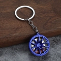 Blauer galvanisierter Metallfelgen-Schlüsselanhänger mit rotem Bremssattel und Ring - Blau