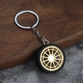 Porte-clés jante de voiture créatif avec rayons dorés et pneu en caoutchouc noir - Or