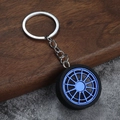Porte-clés jante en métal bleu détaillé avec pneu en caoutchouc noir et anneau argenté - Bleu