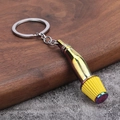 Detail eines Pilzkopf-Luftfilter-Schlüsselanhängers mit Regenbogen-Metall-Finish - Neo-Chrom Gelb