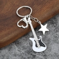 Detail of a music guitar keychain with heart carabiner and star charm on mixed textures - Large Solid / White