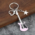 Detail of pink and black guitar keychain with silver heart carabiner and star charm - Small Solid / Pink