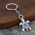 Portachiavi a forma di tartaruga in metallo con strass blu e decorazione floreale - Blu
