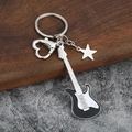 Electric guitar keychain with heart clasp and star charm on a premium wooden background - Small Solid / Black