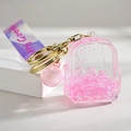 Porte-clés sac à dos rose en acrylique avec paillettes et dragonne Pretty Good - Style Sac à Dos Sable Mouvant Lumineux / Rose Lumineux