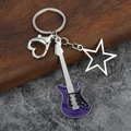 Detail of purple enamel electric guitar keychain with star charm and heart clasp - Large Hollow / Purple