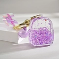 Porte-clés sac à dos violet avec perles de sable et sangle irisante - Style Sac à Dos Sable Mouvant Lumineux / Violet Lumineux