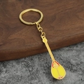 Golden Dombra instrument keychain with yellow enamel and red ethnic floral patterns - Yellow