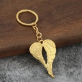 Golden heart-shaped angel wings keychain with detailed feather texture and polished finish - Gold