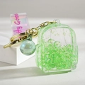 Porte-clés mini sac à dos en acrylique vert clair avec paillettes et anneau doré - Sac à Dos Lumineux Vert