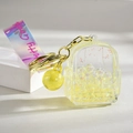 Porte-clés sac à dos en acrylique jaune avec perles colorées et boucle dorée - Sac à Dos Lumineux Jaune Citron