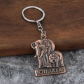 Vintage bronze elephant keychain with I Love Thailand engraving and antique finish - Antique Red