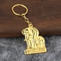 Golden elephant keychain with I Love Thailand engraved charm on a wooden background - Gold