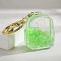 Porte-clés sac à dos acrylique avec paillettes vertes et fermoir mousqueton doré - Fermoir Unique Lumineux Vert