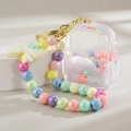 Porte-clés mignon en acrylique avec sables mouvants, billes colorées et nœud crème - Style Chaîne Bonbons Blanc