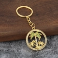 Golden coconut tree keychain with green and white crystals on tropical beach pendant - Gold
