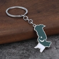 Pakistan map keychain with green white enamel flag and star crescent on wood background - Silver