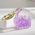 Porte-clés sac à dos en acrylique avec sable pailleté violet et anneau en métal doré - Fermoir Unique Lumineux Violet