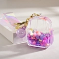 Porte-clés sac à dos en acrylique violet avec perles flottantes et dragonne laser - Style Corde Bonbons Violet