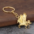 Goldener fliegender Pegasus Schlüsselanhänger aus polierter Legierung mit detailliertem Flügel - Gold