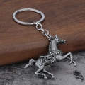 Vintage style jumping horse metal keychain with antique silver finish and detailed saddle - Antique Pewter