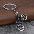 Vintage silver metal alloy bicycle keychain accessory with detailed bike pendant craftsmanship - Antique Pewter