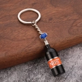 Mini NOS Lachgasflasche Schlüsselanhänger in Schwarz mit orangem Etikett und silbernem Ring - Schwarz