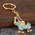 Handcrafted Thailand elephant keychain with blue enamel glaze and golden metal ring - Sky Blue