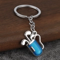Detail of golf bag keychain with blue enamel texture and polished metal finish - Silver Blue