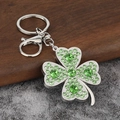 Porte-clés trèfle à quatre feuilles argenté avec strass verts et fermoir homard - Vert