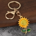 Porte-clés tournesol luxueux plaqué or avec strass étincelants pour sacs à dos - Doré