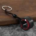 Creative PVC tire keychain featuring black rubber loop with red Win Power text and metal ring - Fist Red
