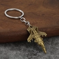 Porte-clés modèle avion de chasse en bronze vintage sur support en bois rustique - Bronze