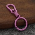 Purple zinc alloy car keychain with a minimalist carabiner design on a wooden background - Rose Red
