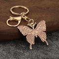 Sparkling butterfly keychain with pink crystals and gold-plated alloy for bags - Light Purple
