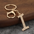 Detailed view of luxury gold letter I keychain with sparkling crystal inlay and lobster clasp - Letter I
