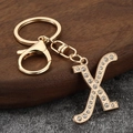 Detail of gold letter X keychain with sparkling crystal rhinestones and lobster clasp - Letter X