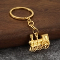 Vintage gold steam locomotive keychain featuring a retro mechanical train engine design - Gold (Imitation Gold)