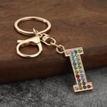 Detail of letter I keychain with colorful rhinestones and golden lobster clasp for bags - Letter I