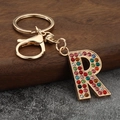 Detail of letter R keychain with colorful crystals and gold metal lobster clasp - Letter R