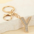 Macro view of gold letter Y keychain with sparkling rhinestones and lobster clasp - Letter Y