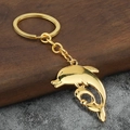 Goldener Delphin Schlüsselanhänger mit poliertem Metallfinish und Doppelanhänger - Gold