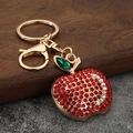 Portachiavi a mela scintillante con strass rossi e chiusura a moschettone in oro - Imitazione Oro Rosso